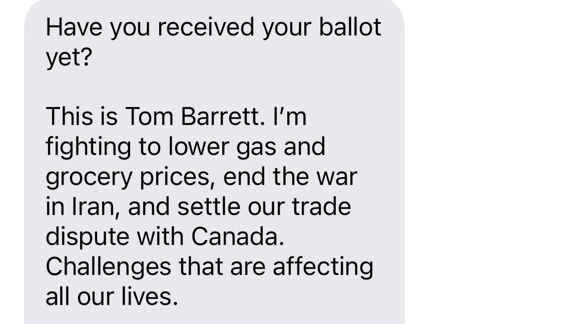 A text message from Tom Barrett asks if the recipient has received their ballot and mentions his efforts to lower gas and grocery prices, end the war in Iran, and resolve a trade dispute with Canada.