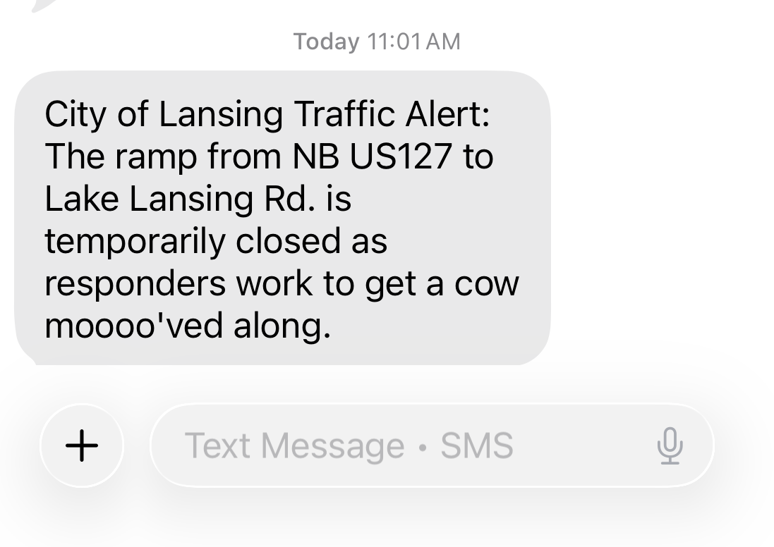 Screenshot of text message that reads City of Lansing Traffic Alert: The ramp from NB US127 to Lake Lansing Rd. is temporarily closed as responders work to get a cow moooo'ved along.